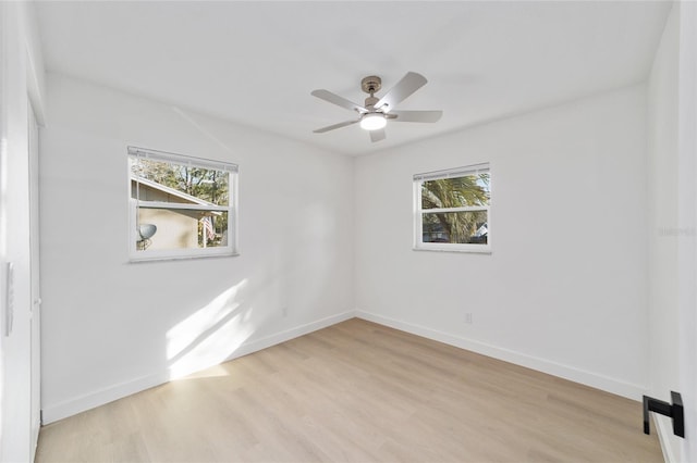 empty room with ceiling fan and light wood-type flooring