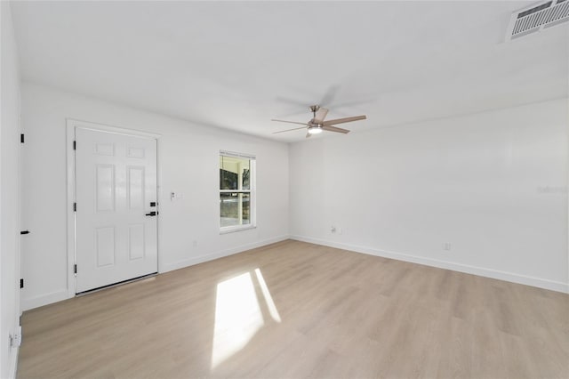 unfurnished room with ceiling fan and light wood-type flooring