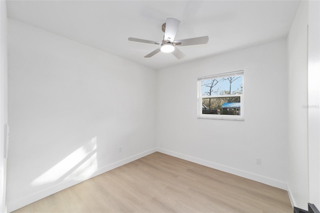 empty room with light hardwood / wood-style floors and ceiling fan