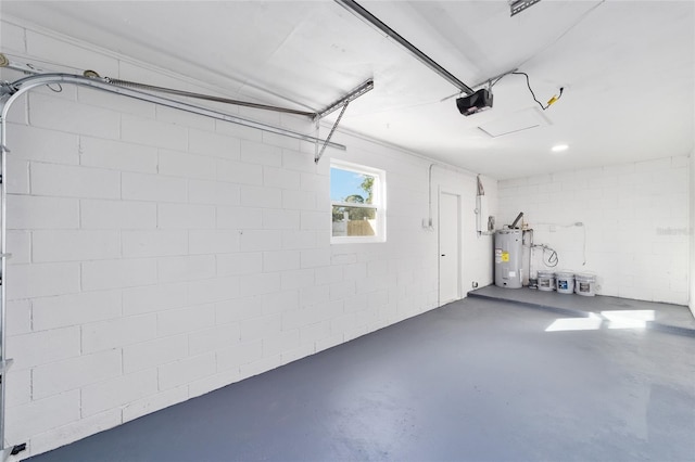 garage featuring a garage door opener and water heater