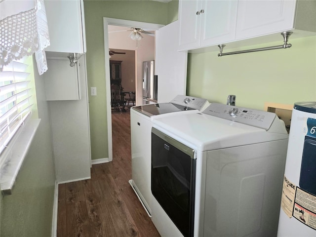 laundry room with dark wood-type flooring, cabinets, washer and dryer, electric water heater, and ceiling fan