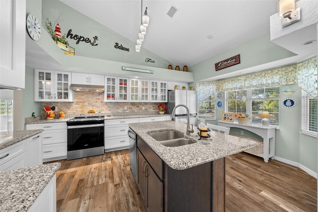 kitchen featuring a kitchen island with sink, sink, stainless steel appliances, and white cabinets