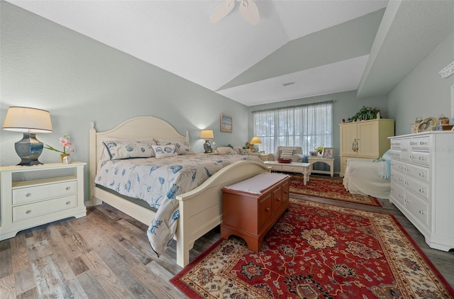 bedroom featuring ceiling fan, lofted ceiling, and light hardwood / wood-style floors