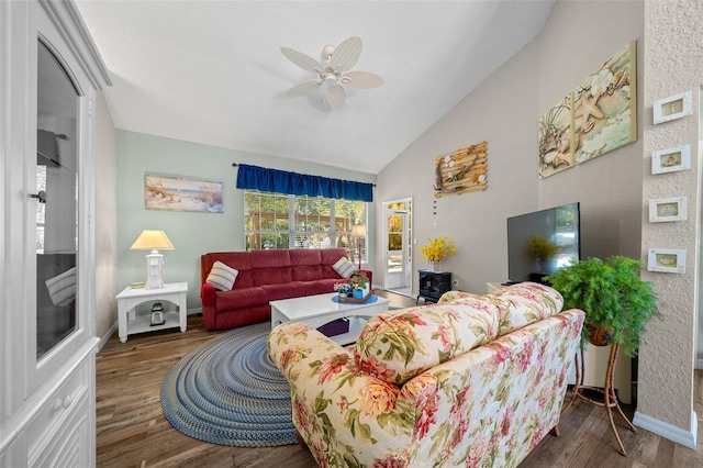 living room with lofted ceiling, dark wood-type flooring, and ceiling fan