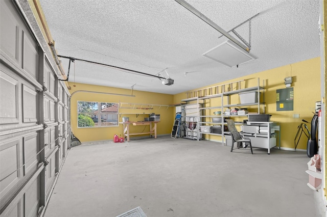 garage featuring a garage door opener and electric panel