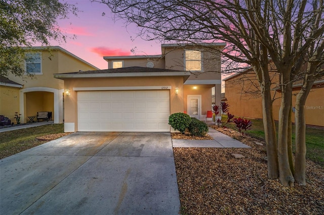 front of property with a garage