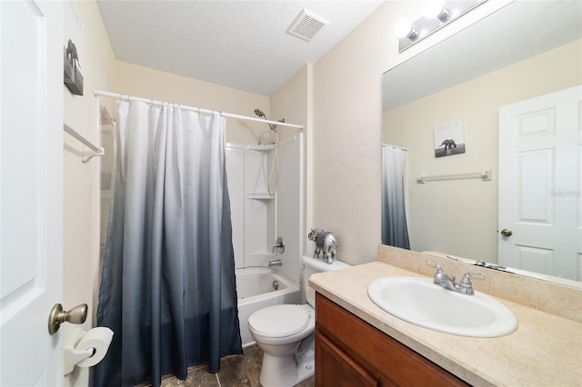 full bathroom with vanity, a textured ceiling, shower / bath combo, and toilet