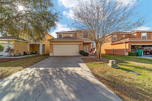 view of front of property featuring a garage and a front yard