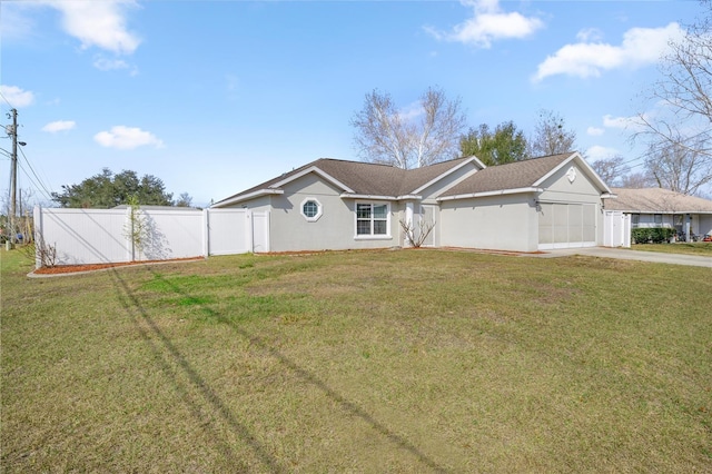 view of front facade with a garage and a front lawn