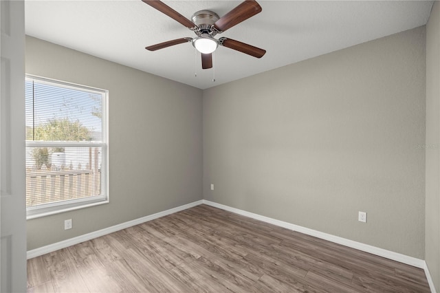 spare room featuring ceiling fan and wood-type flooring