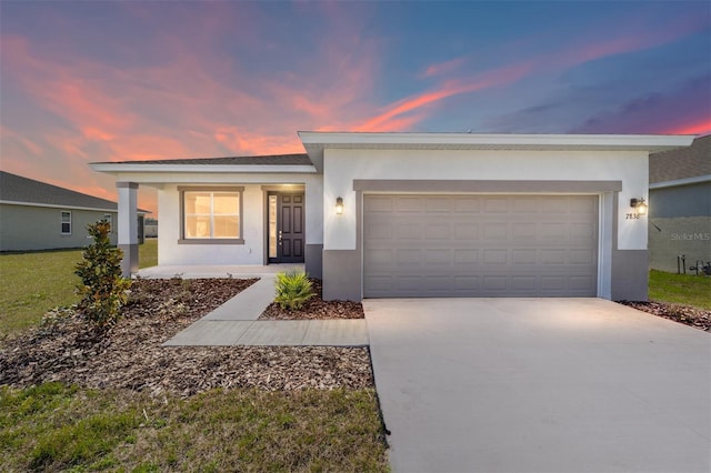 ranch-style home featuring a garage