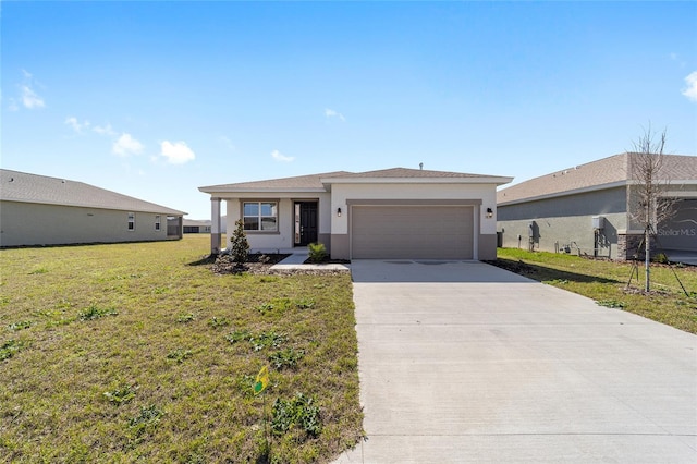 view of front of home featuring a garage and a front yard