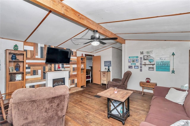 living room featuring lofted ceiling with beams, ceiling fan, a fireplace, and hardwood / wood-style floors