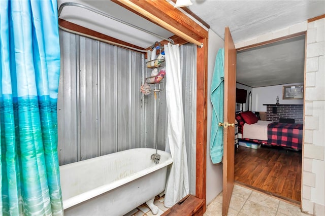 ensuite bathroom with a soaking tub and ensuite bath