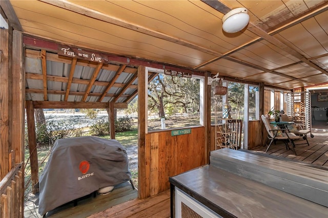 wooden terrace with area for grilling