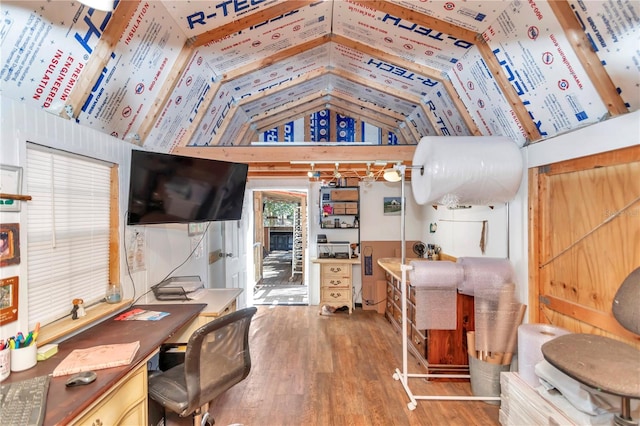 home office with lofted ceiling and wood finished floors