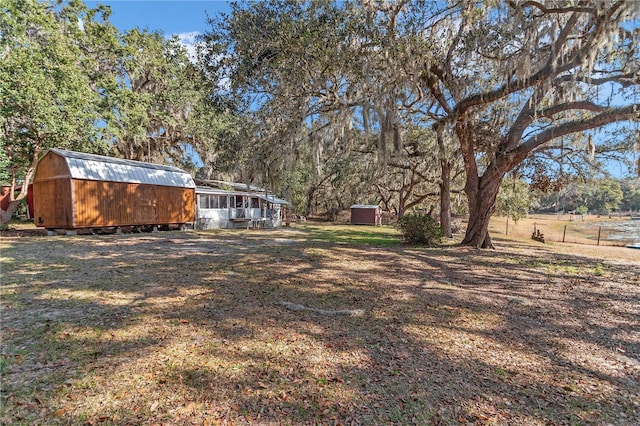 view of yard with a storage unit and an outdoor structure