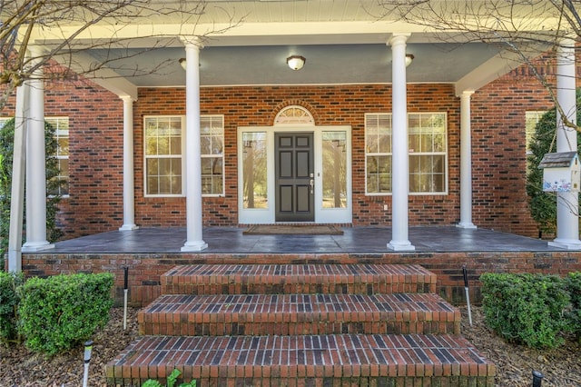 property entrance with covered porch