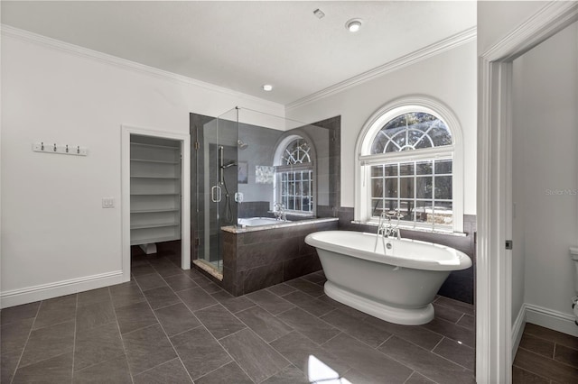 bathroom featuring crown molding, separate shower and tub, and tile patterned floors