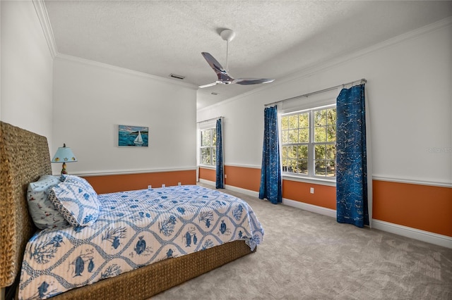 bedroom with multiple windows, crown molding, a textured ceiling, and carpet