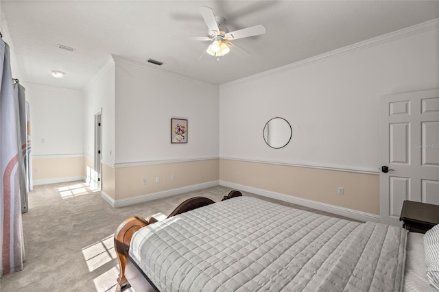 bedroom with ornamental molding, light carpet, and ceiling fan