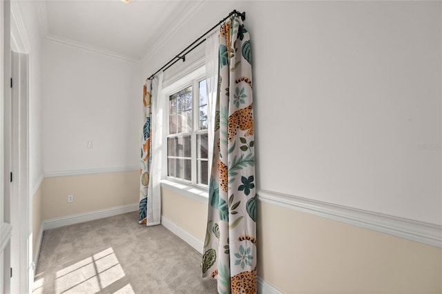 entryway featuring ornamental molding and light colored carpet