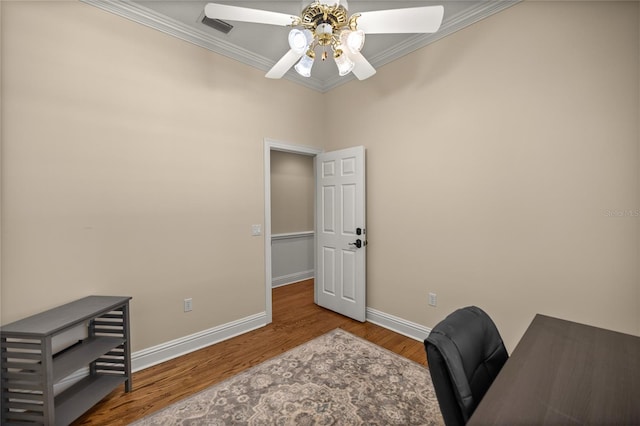 home office featuring crown molding, wood-type flooring, and ceiling fan