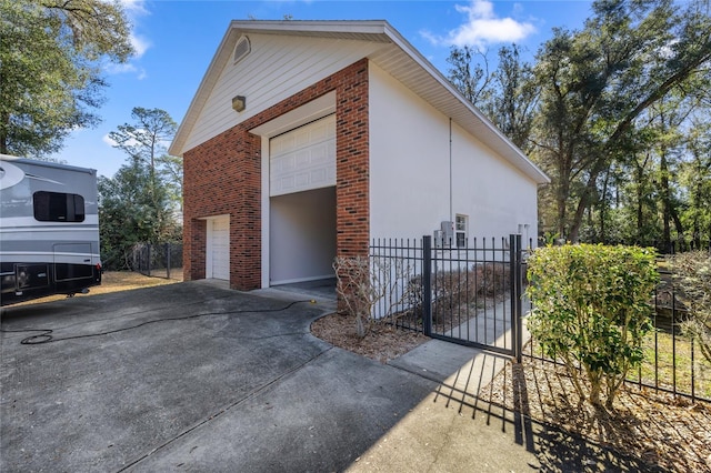 view of side of home featuring a garage