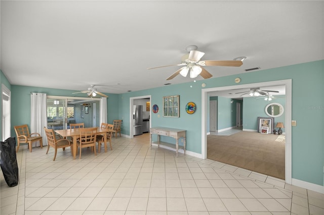 dining space featuring light tile patterned floors