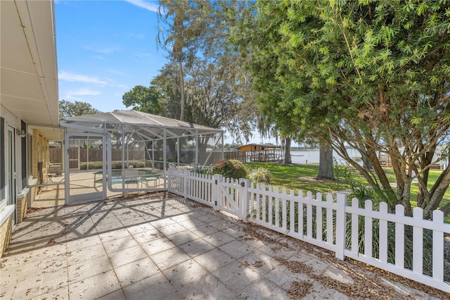 view of patio with a fenced in pool and glass enclosure