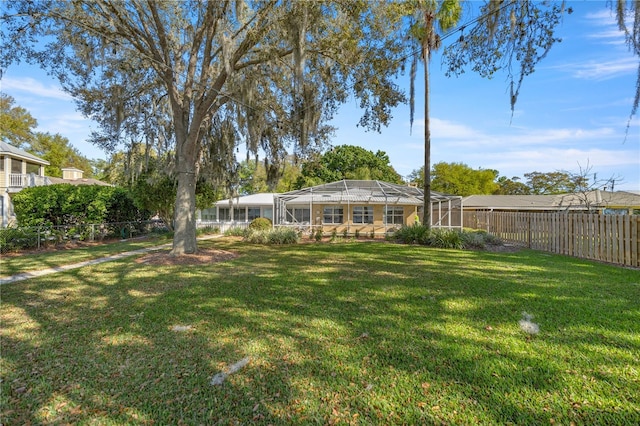 view of yard featuring glass enclosure