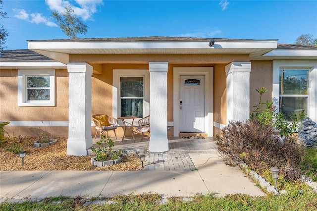 doorway to property with covered porch