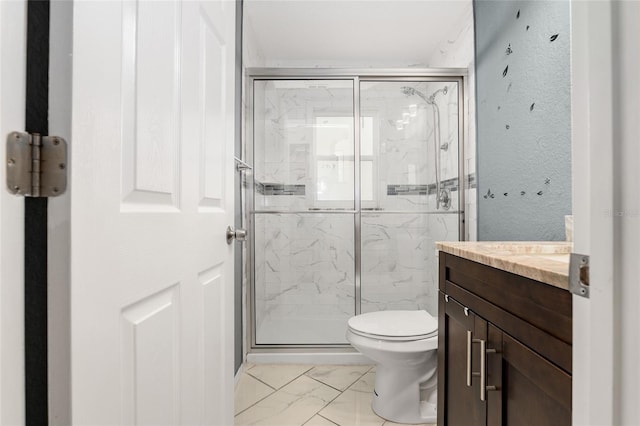 bathroom with vanity, toilet, and walk in shower