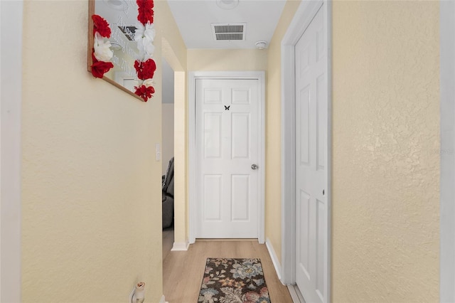 hall featuring light hardwood / wood-style floors