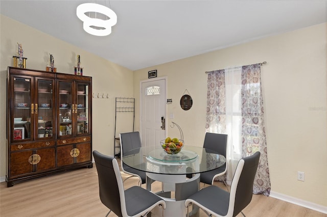 dining room with light hardwood / wood-style flooring