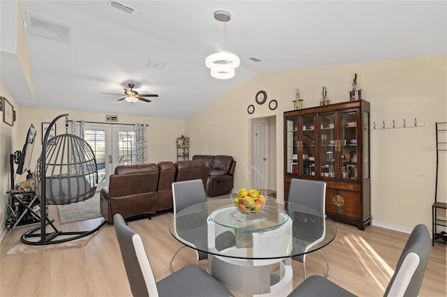 dining area with vaulted ceiling, light hardwood / wood-style floors, french doors, and ceiling fan