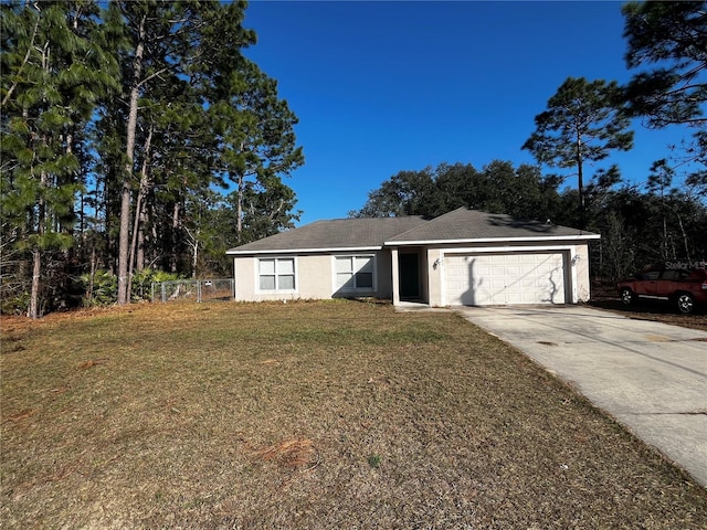 ranch-style home with a garage and a front yard