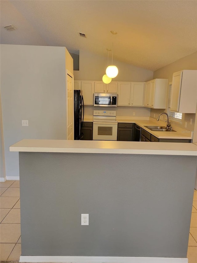 kitchen featuring pendant lighting, sink, white cabinets, light tile patterned floors, and black appliances