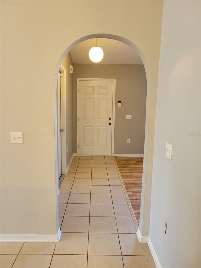 hallway featuring light tile patterned flooring