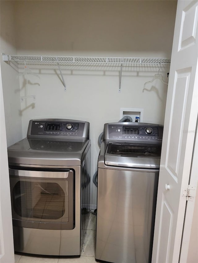 washroom featuring washer and dryer