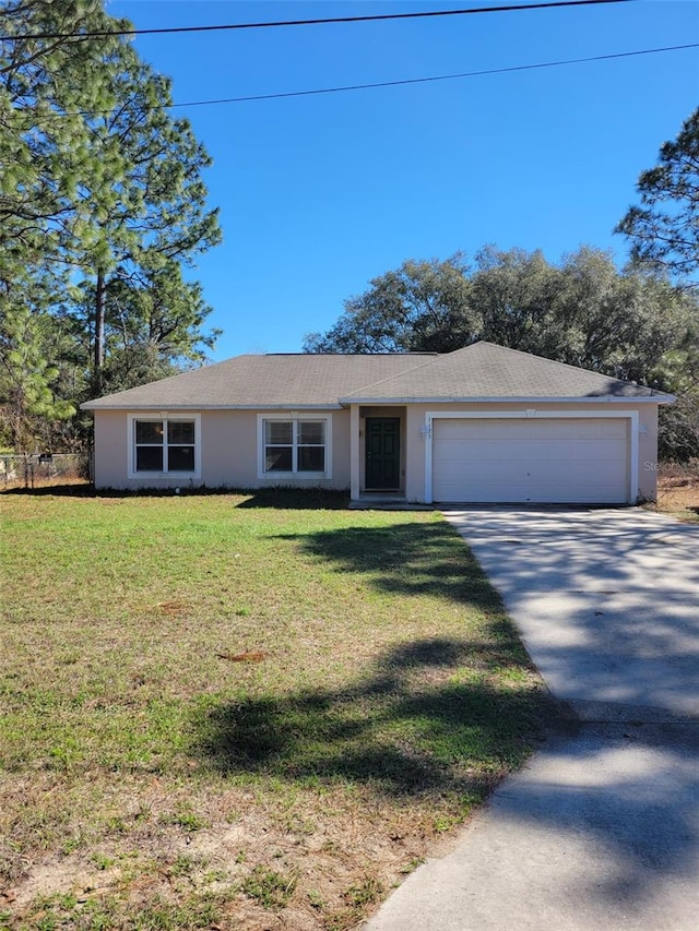 ranch-style house with a garage and a front yard