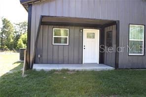 view of outbuilding featuring a lawn