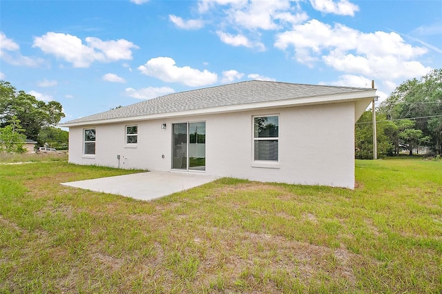13743 SW 113th Ln, Dunnellon, FL 34432 - back of house featuring a lawn, a patio, and stucco siding
