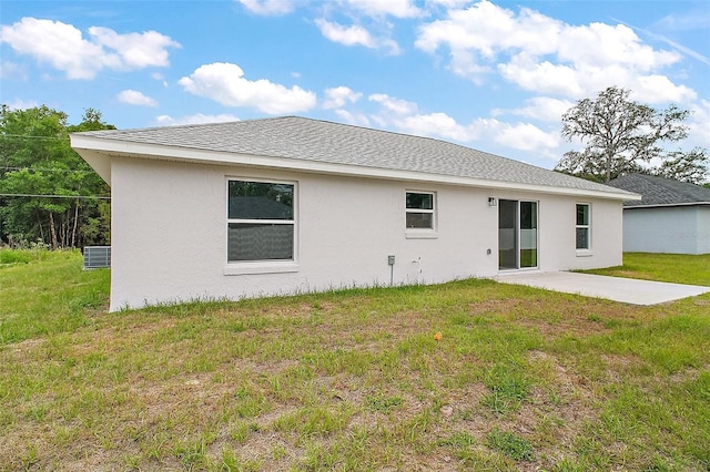 13743 SW 113th Ln, Dunnellon, FL 34432 - back of property featuring a patio, stucco siding, and a yard