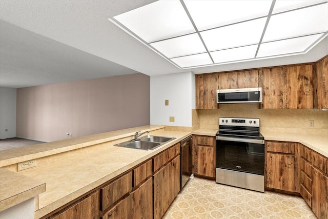 kitchen featuring appliances with stainless steel finishes and sink