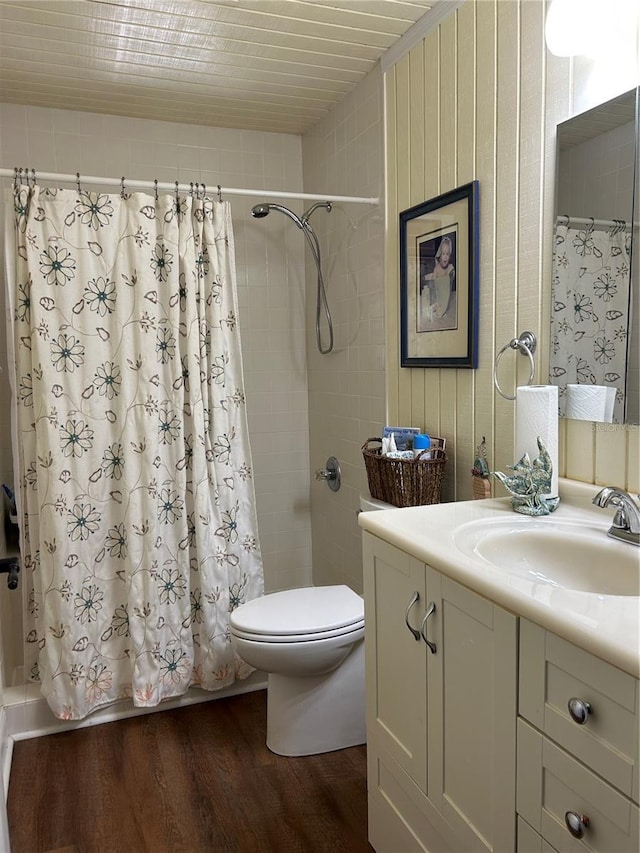 bathroom featuring vanity, toilet, and hardwood / wood-style floors