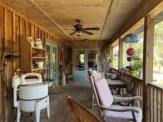 exterior space featuring wooden ceiling, french doors, and ceiling fan