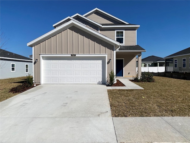 view of front facade featuring a garage and a front yard