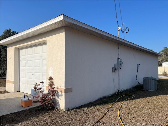 view of side of property featuring central AC unit