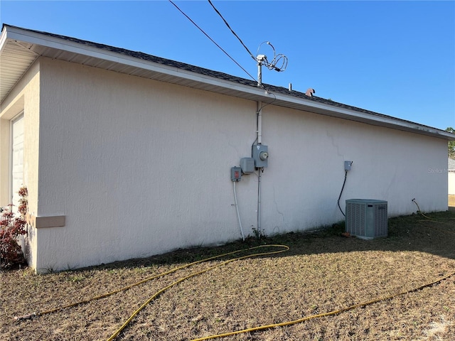 view of side of property with central AC